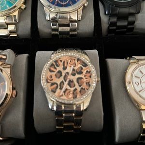 Gold watch with cheetah background